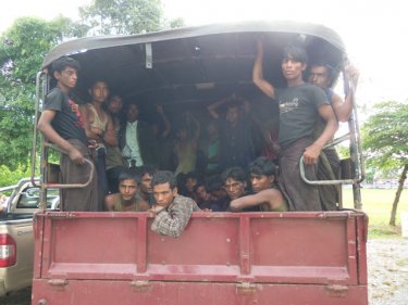 After a long voyage, Rohingya boatpeople are trucked  to the Thai Army