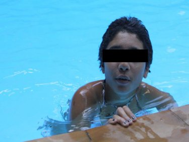 French girl Manel enjoys a swim last night in a Patong resort