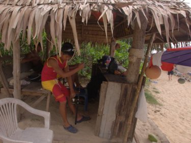 Yai Nui, 2pm Sunday, and a lifeguard adjusts a fishing rod