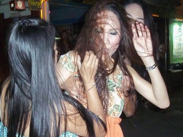The ladyboy and the bar hostess debate the virtues of a Phuket visitor