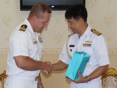 All hands on shaking duty as the Royal Thai Navy's Commander Kitsada Kulteeya greets US Navy Captain Chris Cegielski today