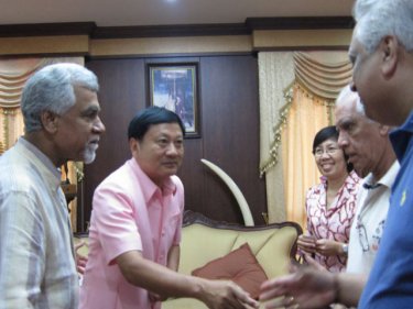 Fathers of the bride and groom and friends meet Phuket's Governor