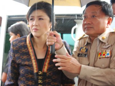 Phuket greeted Prime Minister Yingluck Shinawatra with a protest and rain