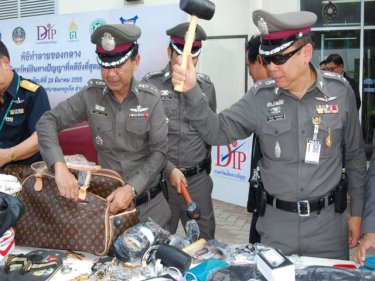 Police put copy goods under the hammer in Phuket City this afternoon
