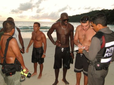 The missing man's friends help police with information at Freedom Beach