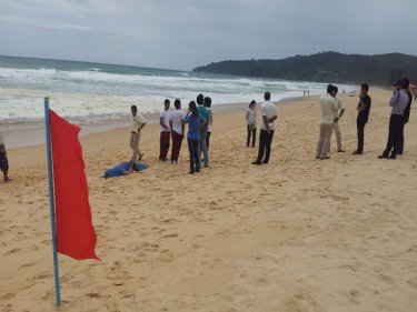 The body of the young tourist on the sand at Phuket's Karon beach  today