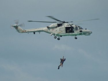 A chopper plucks a person from the sea in today's rescue drill