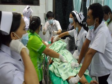 Nurses and medical staff attend to Nattapol Nuawla-Ong last night
