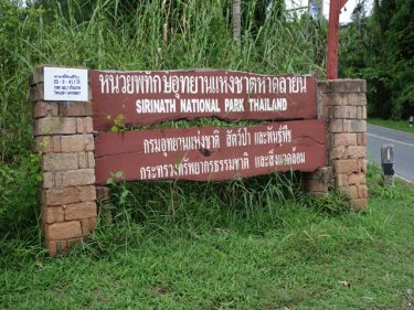 The Phuket park where billions of baht in property is said to have been taken. The smaller sign on the left post advertises some land for sale