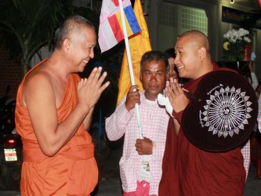 Athin Lilajala (right) is greeted at a Phuket temple last night