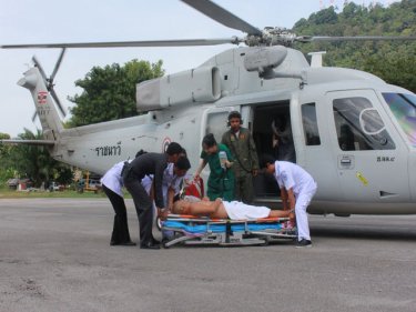 The rescued man is unloaded from the helicopter on Phuket today
