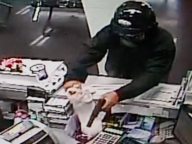 The Phuket bank robber points the gun and gets his money today