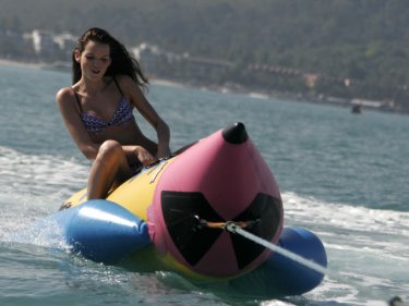A tourist rides a banana boat similar to the one in the fatal crash