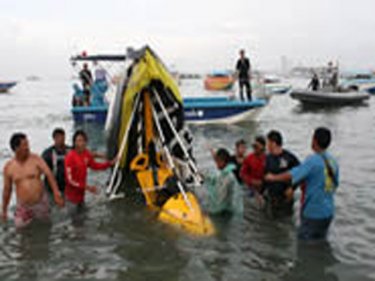 The wreckage of the microlight is brought ashore in Pattaya today
