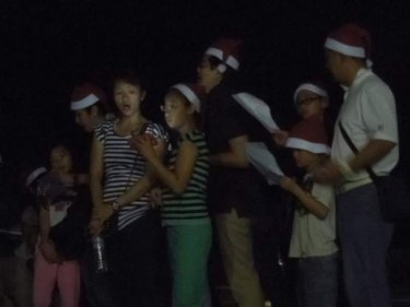 Santa carol singers at the tsunami cemetery lasy night