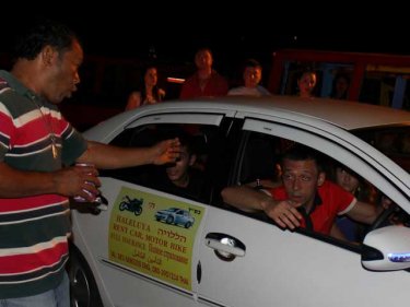 An irregular taxi driver is confronted during last night's Phuket blockade