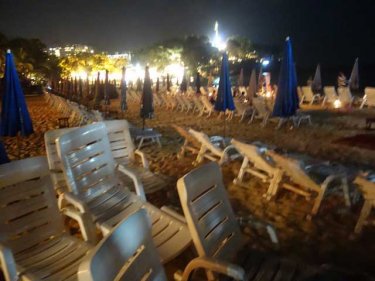 Lounge chairs left on the beach at Kata create a drinking spot