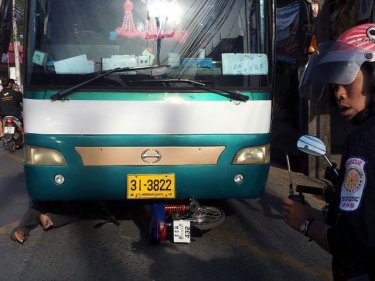 The legs protrude from the bus in Phuket's Samkong district yesterday