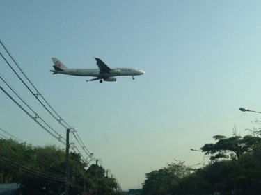 Here comes another one . . . a Dragonair flight heads for a Phuket landing