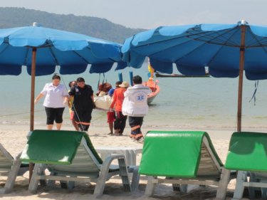 The Russian tourist's body is brought ashore at Karon today