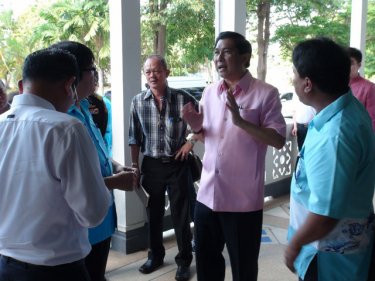 Phuket Governor Maitree Intusut talks to taxi drivers this week
