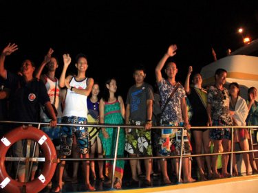 Relieved tourists return to Phuket after a ferry almost sank in rough weather