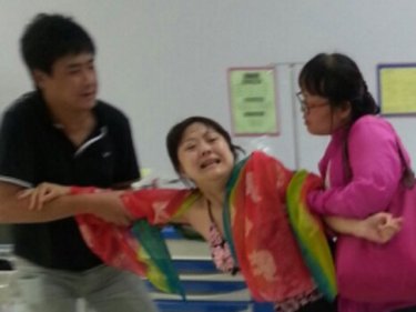 A woman grieves for Chen Peng, latest Chinese tourist to die,  today