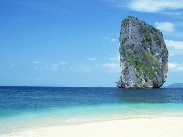A signature karst rises off the coast of Krabi's beautiful Poda Island