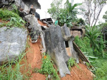 Fake concrete trees slide on Big Buddha hill near workers' huts