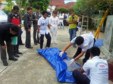 A body is wrapped for removal after a Phuket man killed his neighbor