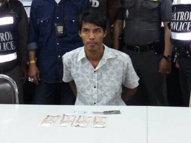 Alleged bandit Narucha with the loot and the knife at Phuket City station