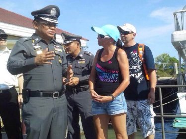 The Region 8 police commander meets tourists on a Phuket pier today