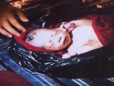 Swaddled in a garbage bag, the left baby boy found in a pickup