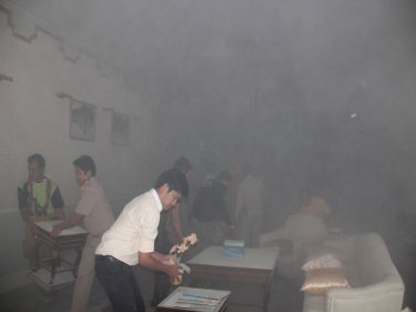 Smoke forces staff to clear a room at Phuket Provincial Hall yesterday