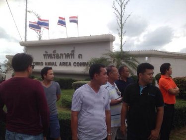 Drivers of illegal taxis  outside Phuket's navy base today