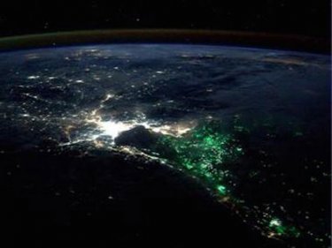 A photo taken from space shows a strange green glow off Bangkok
