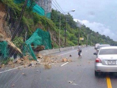 Rocks tumble onto the bypass road and a power pole leans today