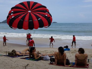 No sunbeds, but parasailers and jet-skis continue at Phuket's Patong beach
