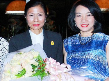 Yuwadee Chirathivat, CEO of Central Department Store Co Ltd, congratulates Tourism and Sport Minister Kobkarn Wattanavrangkul (left) on her new role