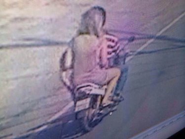 A security camera recorded the Russian woman on the motorcycle