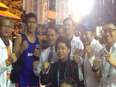 Governor Nisit and Patong Mayor Chalermlak join the Muay Thai boxing at the Fourth Asian Beach Games last night