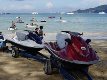 A jet-ski operator tests out the swimmers' zone at Patong beach