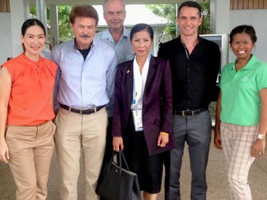 The Tourism Minister (centre) meets the team at Thanyapura
