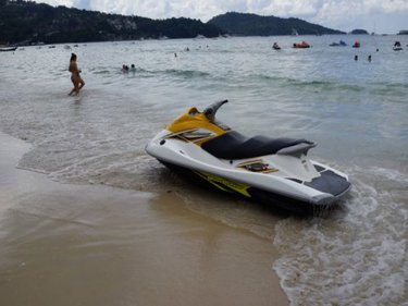 Danger ignored: Swimmers go into the jet-ski zone at Patong today