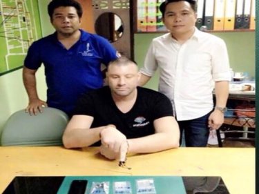 An accused drugs suspect named as Taylor Grainger performs a manoeuvre known as ''the point'' at Kathu Police Station in Patong