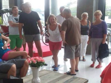 Angry passengers gather in the foyer of the Dara Hotel today