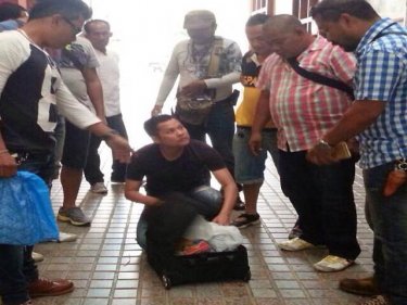 Outnumbered, the Taiwanese man is taken into custody on Phuket