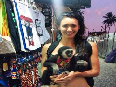 Playboy model and Miss Universe 2005 Natalie Glebova on Phi Phi with a playmate who shouldn't be there: ''Cutest gibbon in the cutest little outfit''