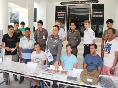 The three Russians are held by police on Phuket today
