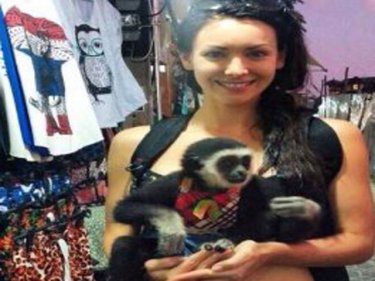Animal lover Natalie Glebova with a gibbon dressed as a human baby